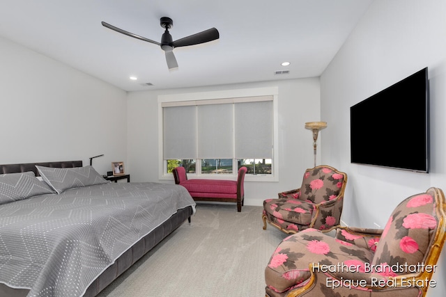 bedroom with light carpet and ceiling fan