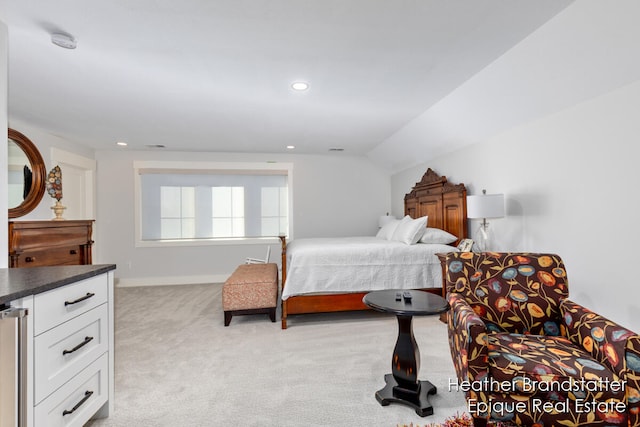 carpeted bedroom featuring vaulted ceiling