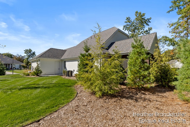 rear view of property featuring a yard