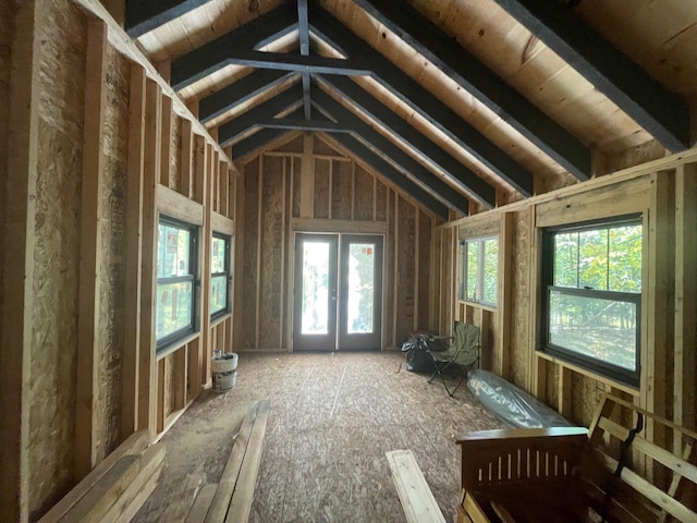 misc room featuring french doors, lofted ceiling, and a healthy amount of sunlight