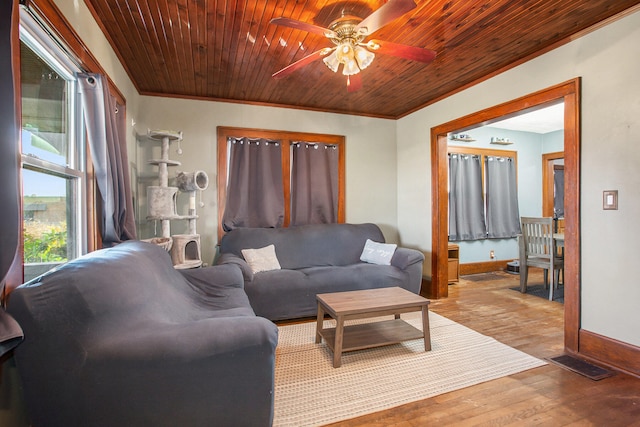 living room featuring ceiling fan, wood ceiling, crown molding, and hardwood / wood-style floors