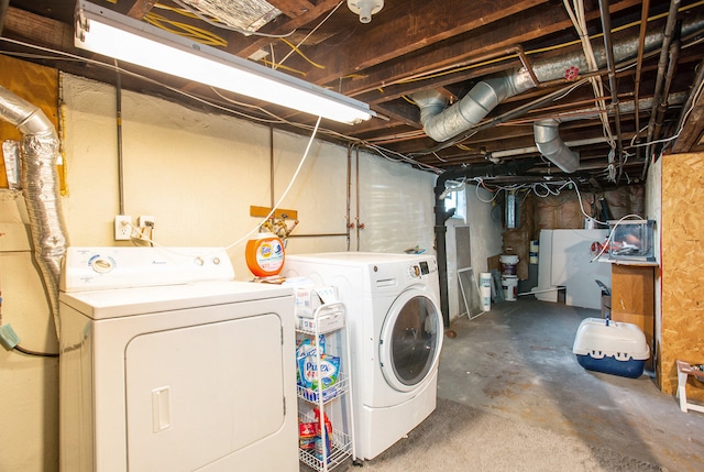 washroom featuring independent washer and dryer