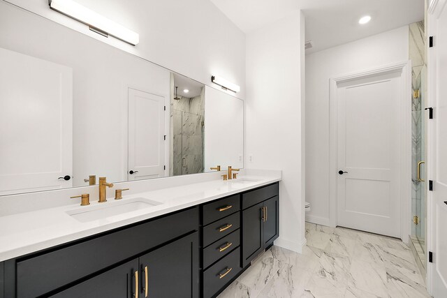 bathroom with vanity, toilet, and walk in shower