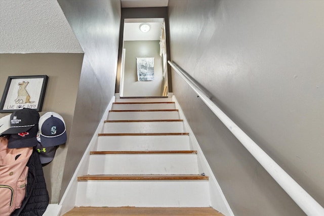 stairway with wood-type flooring