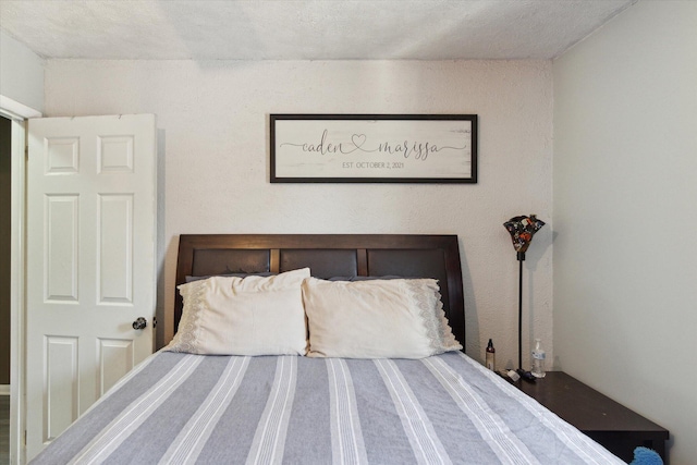 bedroom featuring a textured ceiling