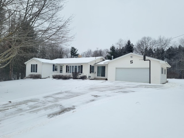 single story home featuring a garage