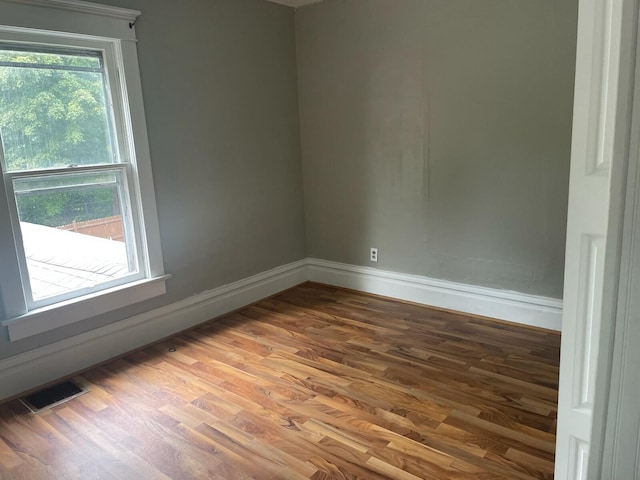 empty room with wood-type flooring