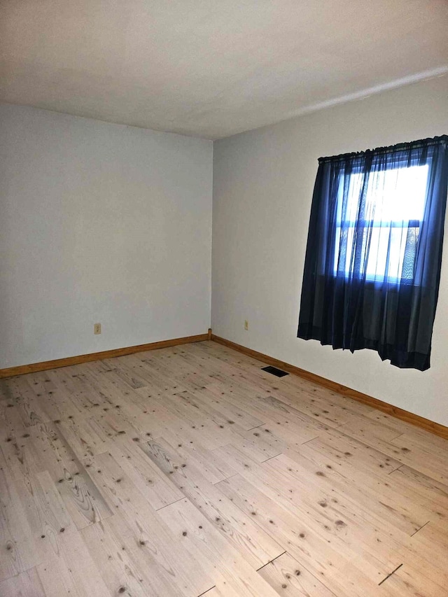 empty room featuring light wood-type flooring