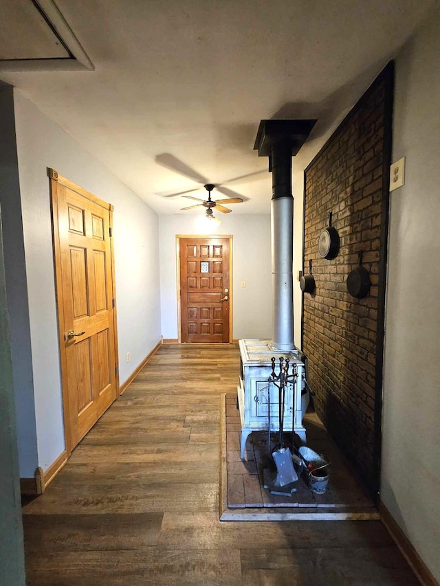 interior space featuring ceiling fan and wood-type flooring