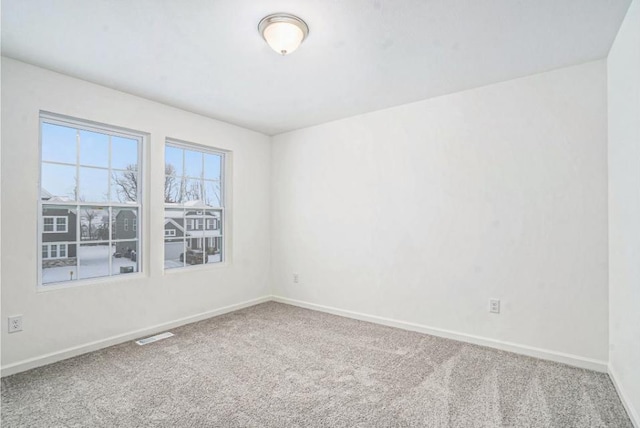 empty room with carpet flooring