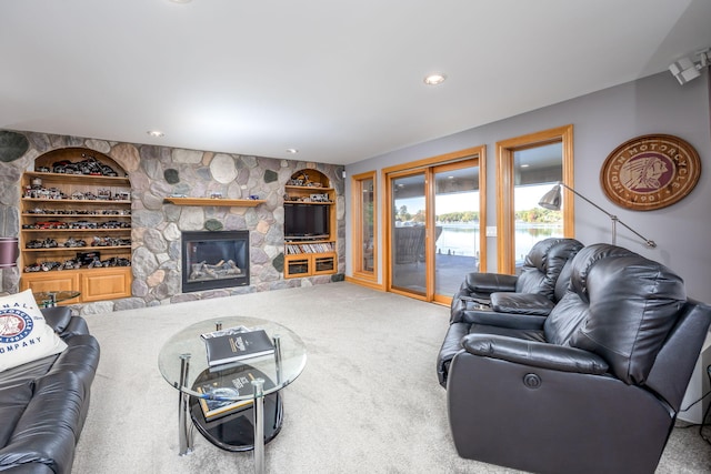 living room with a fireplace and carpet flooring