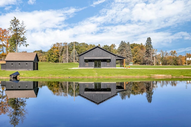 exterior space featuring a yard and a water view