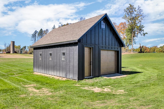 view of outdoor structure featuring a lawn