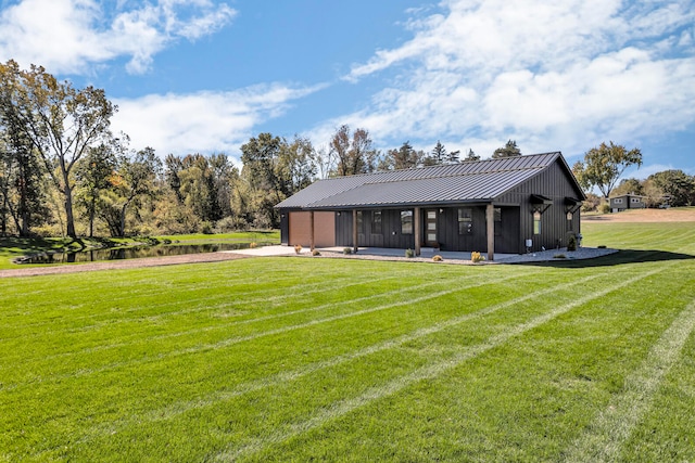 exterior space with a sunroom and a lawn