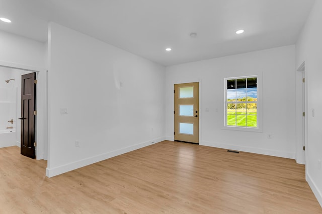 unfurnished room featuring light hardwood / wood-style floors