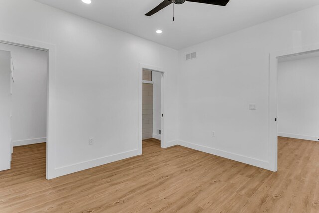 unfurnished bedroom featuring light hardwood / wood-style floors and ceiling fan