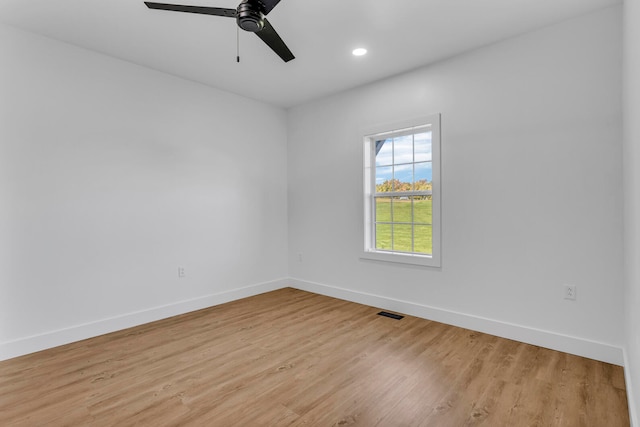 unfurnished room with ceiling fan and light hardwood / wood-style flooring