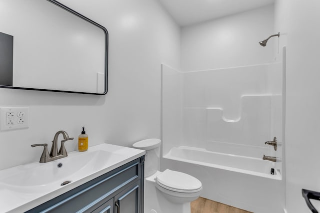 full bathroom featuring wood-type flooring, vanity, toilet, and shower / bathtub combination