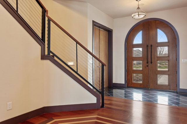 foyer featuring french doors and dark hardwood / wood-style floors