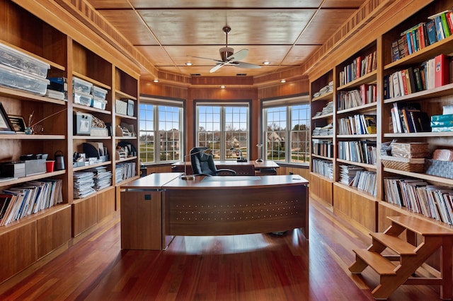 home office with plenty of natural light and hardwood / wood-style floors