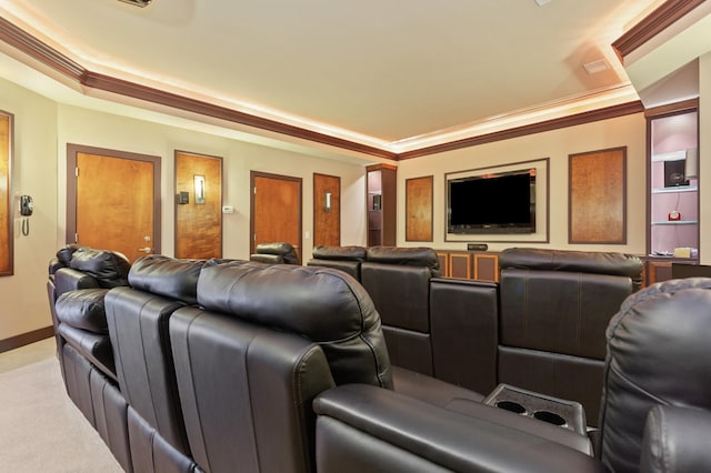 cinema room featuring ornamental molding and light colored carpet