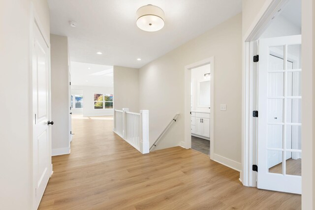 hall with light hardwood / wood-style flooring