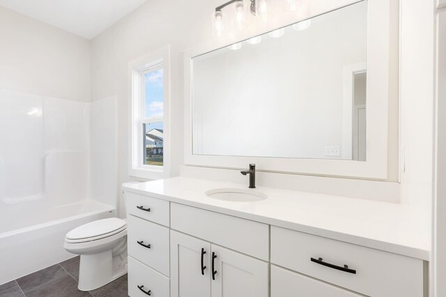 full bathroom with shower / bath combination, vanity, toilet, and tile patterned floors