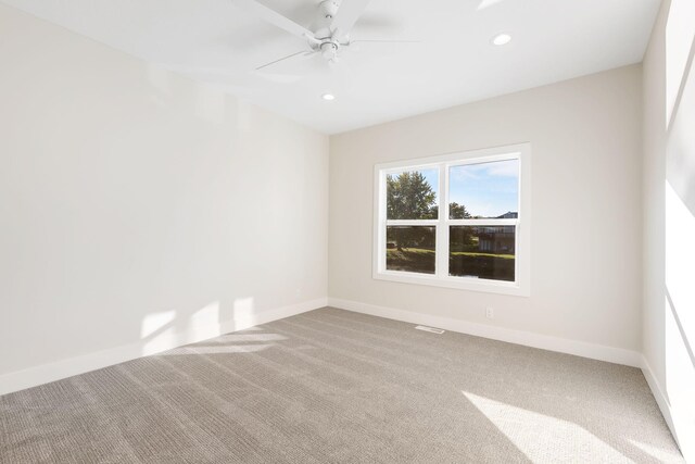 empty room featuring carpet and ceiling fan