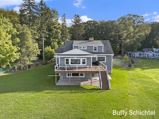 3163 N Scenic Dr, Muskegon, MI 49445 - rear view of house with stairs, a yard, a wooden deck, a chimney, and a shingled roof