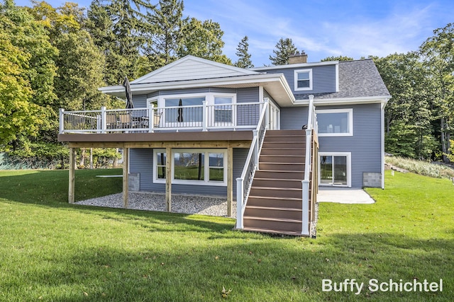 3163 N Scenic Dr, Muskegon, MI 49445 - back of house featuring a yard, a chimney, a patio, stairs, and a deck