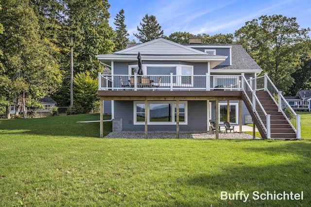 3163 N Scenic Dr, Muskegon, MI 49445 - rear view of house with a lawn, a patio, a chimney, and a deck