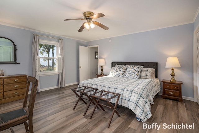 3163 N Scenic Dr, Muskegon, MI 49445 - bedroom featuring ceiling fan, ornamental molding, baseboards, and wood finished floors