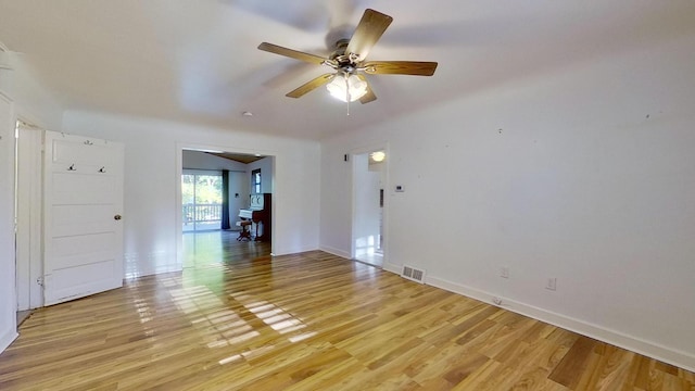 spare room featuring light wood-type flooring and ceiling fan