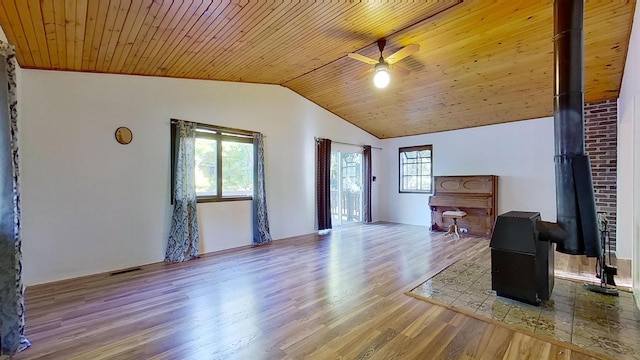 living room with light hardwood / wood-style floors, lofted ceiling, a healthy amount of sunlight, and wooden ceiling