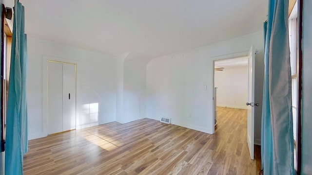 spare room with light hardwood / wood-style flooring