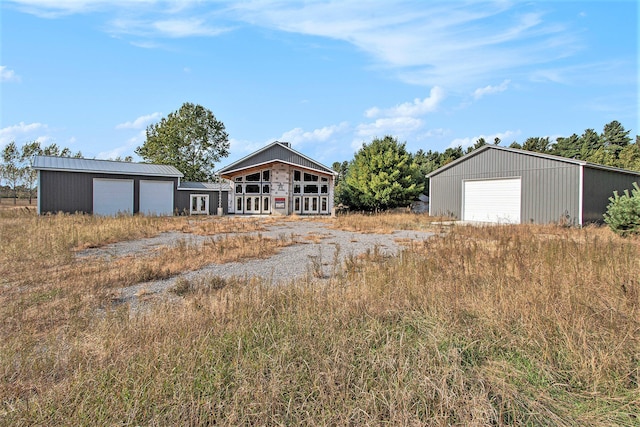 view of front of property with an outbuilding and a garage