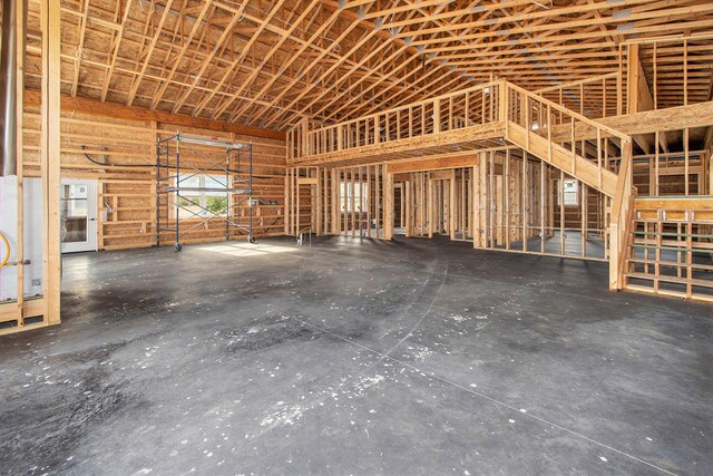 miscellaneous room with a towering ceiling