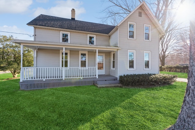 view of front of home with a porch and a front lawn