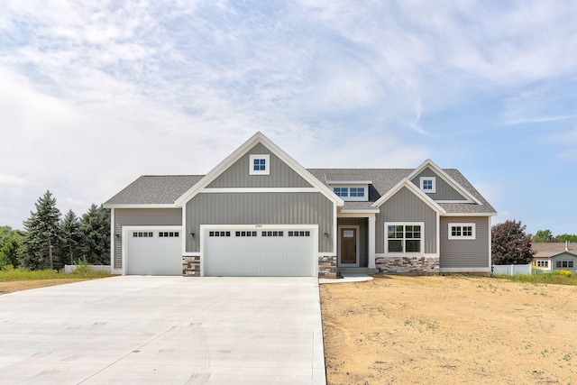 craftsman inspired home with a garage