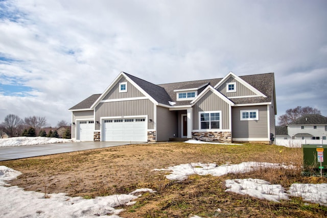 craftsman-style house with driveway, a garage, stone siding, roof with shingles, and board and batten siding