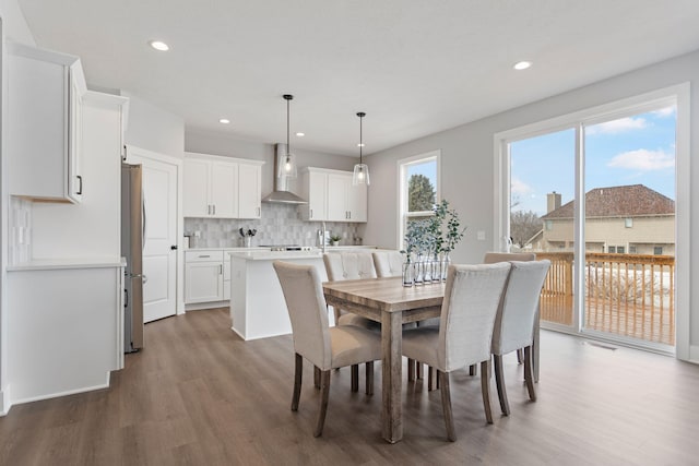 dining area featuring visible vents, wood finished floors, and recessed lighting