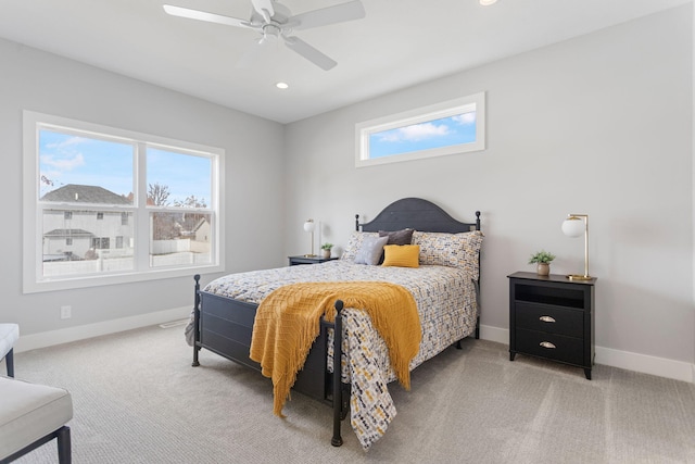 bedroom featuring light carpet, baseboards, a ceiling fan, and recessed lighting