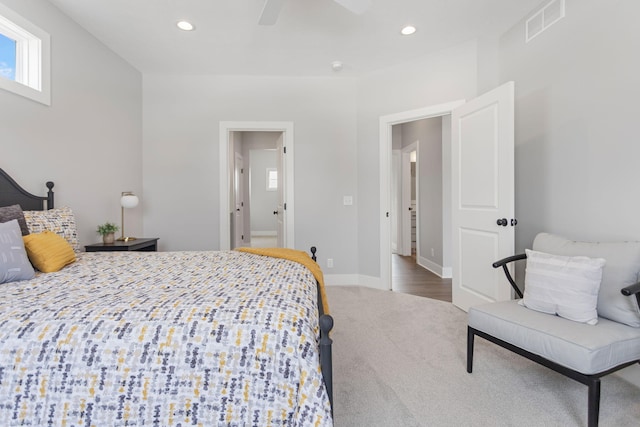 carpeted bedroom with a ceiling fan, recessed lighting, visible vents, and baseboards