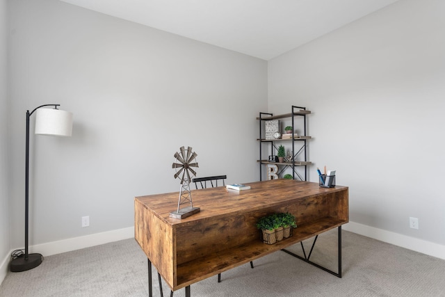 home office featuring carpet flooring and baseboards