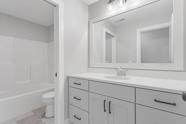 bathroom featuring toilet, visible vents, shower / washtub combination, and vanity