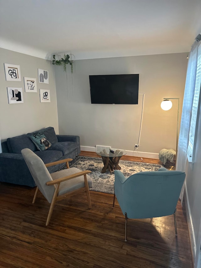 living room with dark hardwood / wood-style floors