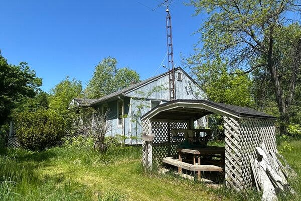 exterior space with a carport