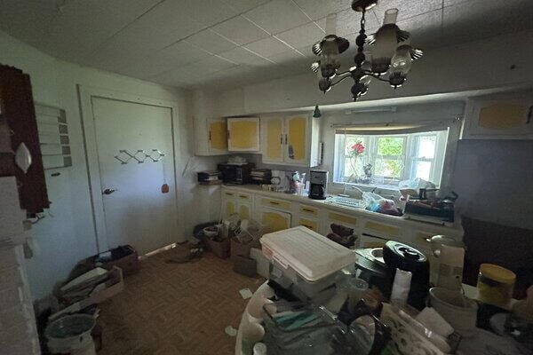 kitchen featuring a chandelier