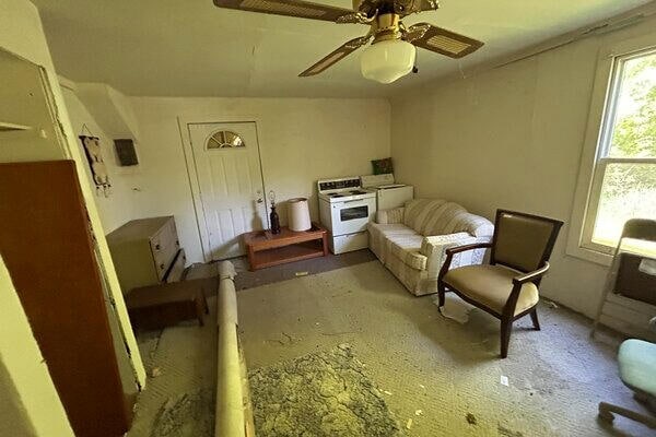 sitting room featuring washer / dryer, ceiling fan, and lofted ceiling