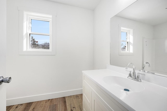 bathroom with vanity and hardwood / wood-style floors